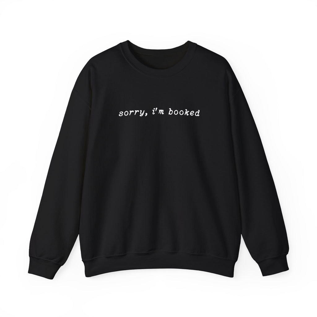 thtgrlreads black oversized crewneck sweatshirt with vintage white typewriter font text reading "sorry, i'm booked" in a cozy, relaxed fit design