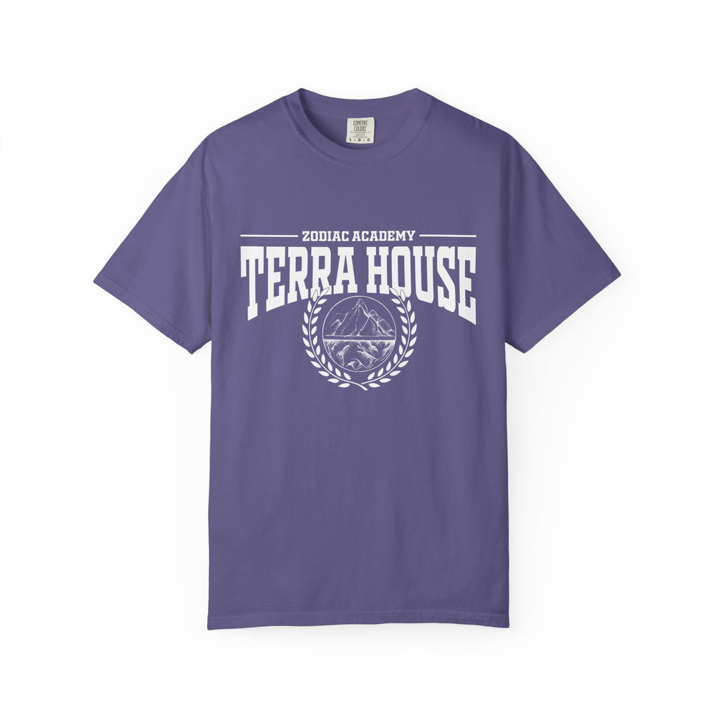 A purple Comfort Colors graphic tee from thtgrlreads featuring a vintage white print with "Zodiac Academy Terra House" text and a mountain emblem, part of Zodiac Academy and Back to School collections.