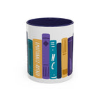 Ceramic mug from thtgrlreads featuring colorful vertical book spines with titles including "Emotionally-Ruined" and "NC" in a playful, graphic design on a white base with a dark blue interior.