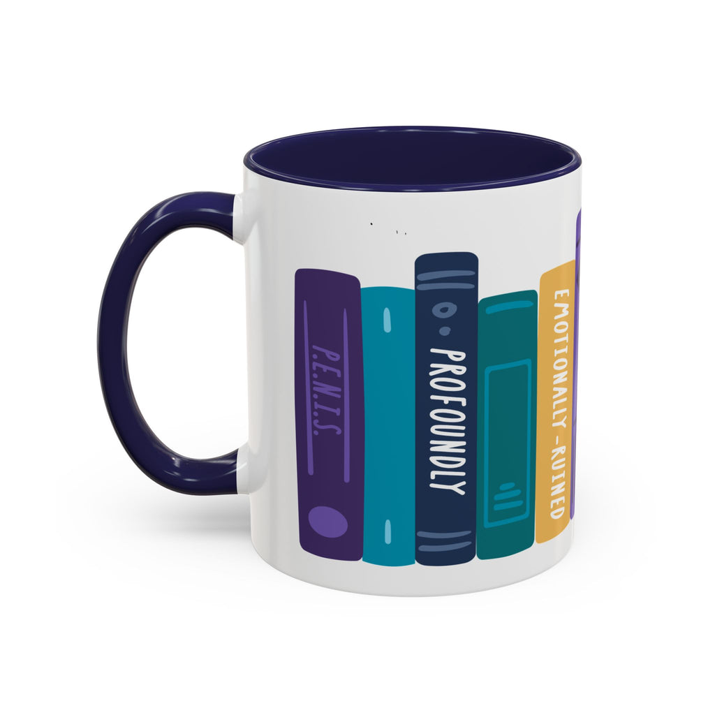 White ceramic mug with a dark blue handle and interior, featuring a colorful graphic of vertically aligned book spines with titles including "Remus," "Profoundly," and "Emotionally Ruined.