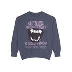 Thtgrlreads Ruthless Boys of the Zodiac collection oversized crewneck sweatshirt in vintage wash, featuring a bold graphic with distressed text and monster fang design in muted purple and black tones.