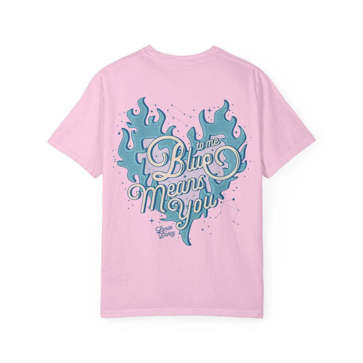 A Zodiac Academy comfort colors graphic tee from thtgrlreads in light pink featuring a vintage wash and a large vintage puff print graphic of a blue flaming heart with the phrase "Blue means you" in retro script font.