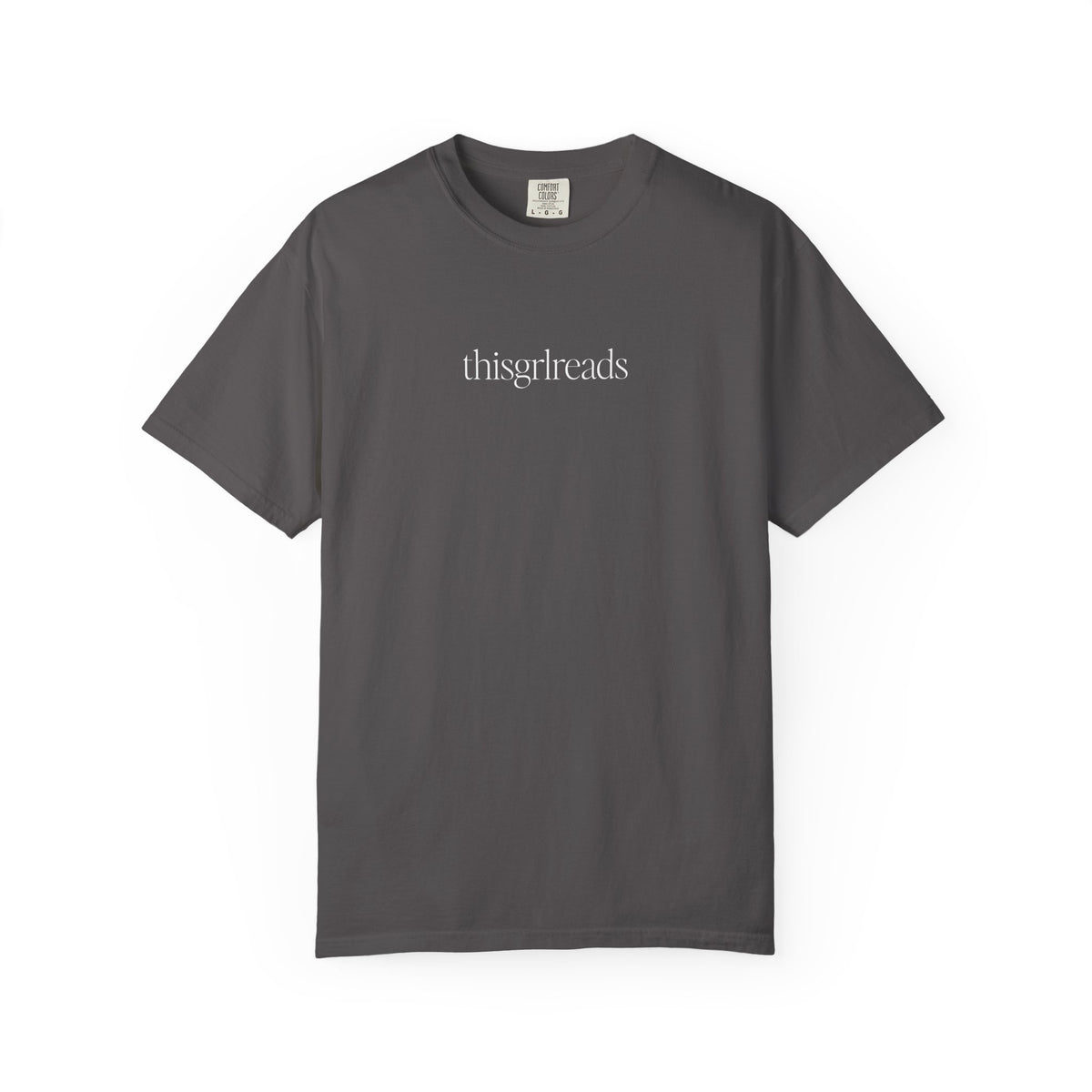 Thtgrlreads officially licensed thisgrlreads Tee from the Book Bestie collection, a vintage wash Comfort Colors graphic tee with minimalist text in a relaxed unisex fit.