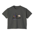 Nocticadia collection from thtgrlreads features a vintage-wash Comfort Colors dark gray crop top with gothic script "Dr. Death" text and whimsical alchemy bottle and skull graphic, part of fantasy romance Tees.