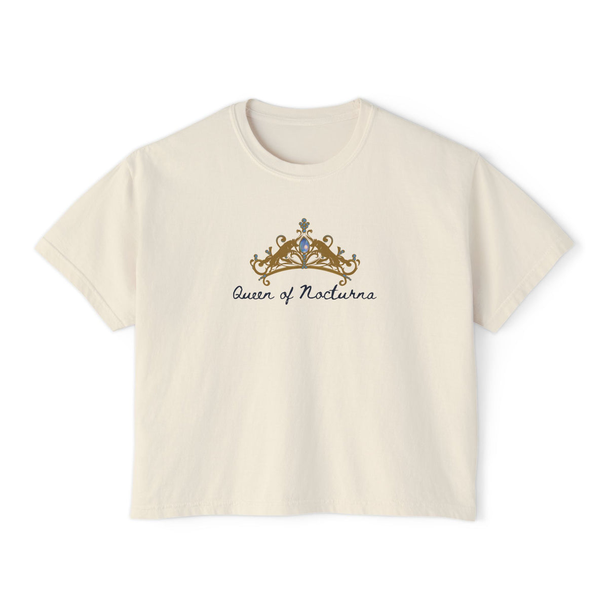 Thtgrlreads Wolves of Ruin collection cream Comfort Colors crop top featuring a vintage-style golden crown graphic with "Queen of Nocturna" script in elegant font.