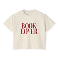 Thtgrlreads vintage-wash cream Comfort Colors cropped t-shirt from the Tees collection featuring bold red "BOOK LOVER" text in a classic serif font, perfect for bookish style.