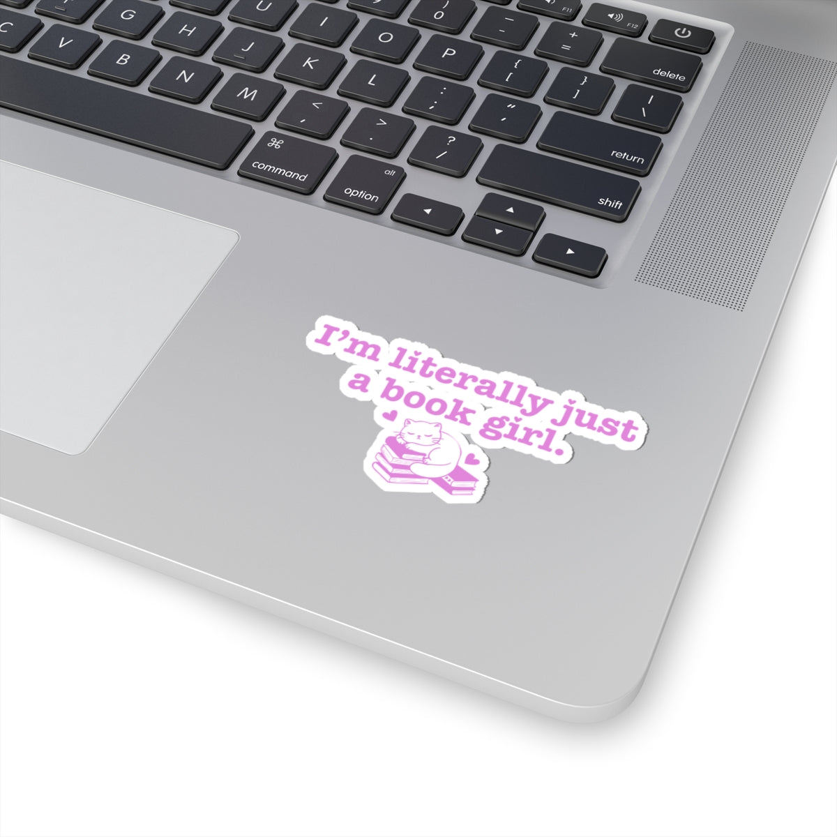 Sticker from thtgrlreads' Book Bestie collection featuring purple text saying "I'm literally just a book girl" above a cute illustration of a cat reading on stacked books.