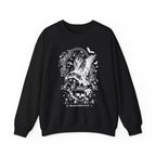 Black oversized crewneck sweatshirt from thtgrlreads Liv Zander collection featuring a vintage puff print graphic of a crow in flight surrounded by roses, skulls, and bats with gothic script text.