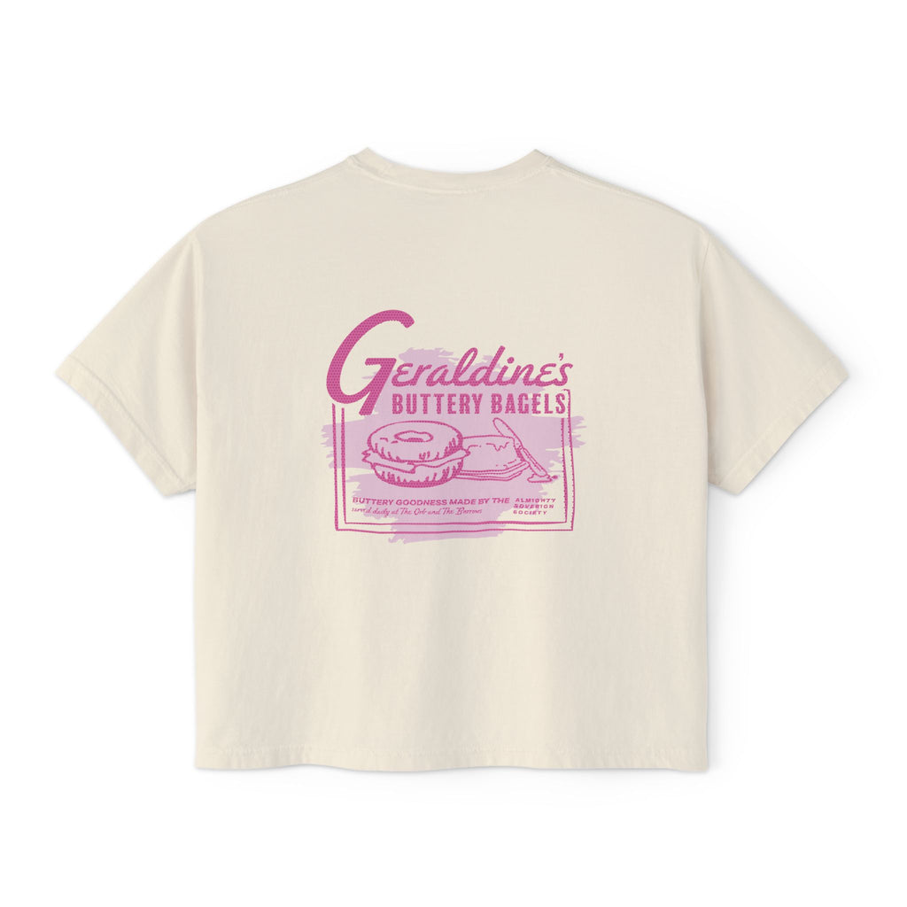 thtgrlreads Zodiac Academy collection features a cream-colored Comfort Colors cropped t-shirt from Printify with a vintage-style pink graphic of bagels and retro text inspired by Geraldine’s Buttery Bagels.