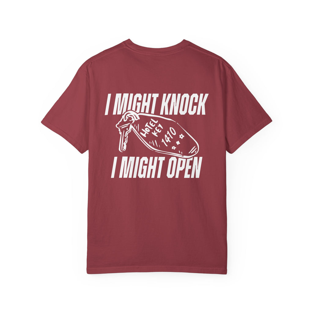 Unisex Comfort Colors graphic tee from thtgrlreads featuring a vintage washed burgundy base with white vintage puff print text reading "I Might Knock I Might Open" and a hotel key graphic, part of Hockey Romance and related collections.