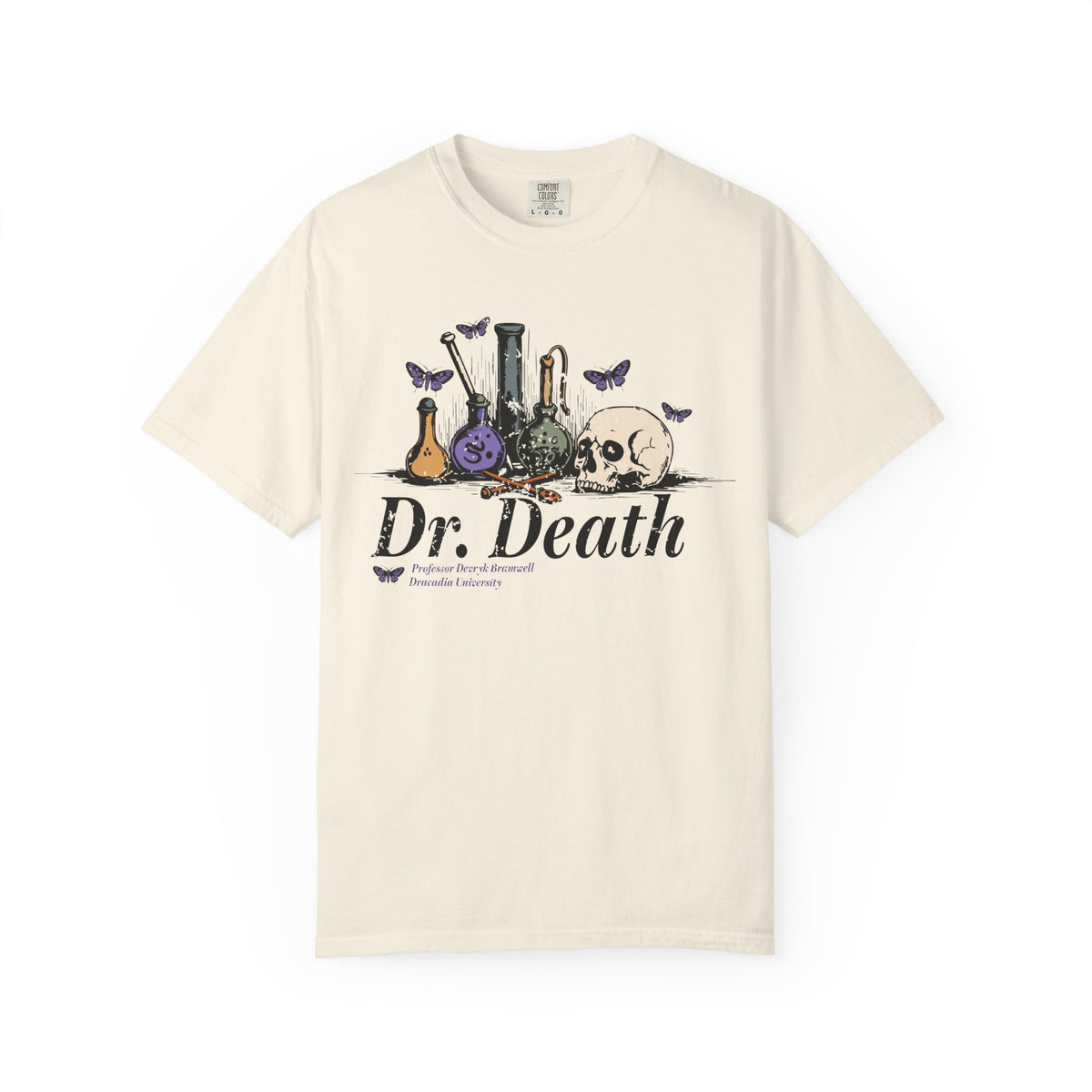 A vintage wash Comfort Colors graphic tee from thtgrlreads featuring a gothic design with laboratory glassware, a skull, and butterflies, inspired by Nocticadia themes.