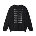 Thtgrlreads book bestie collection oversized crewneck sweatshirt in vintage black with white text listing each day of the week paired with "READ" in a bold typewriter font, cozy unisex fit from comfort colors.