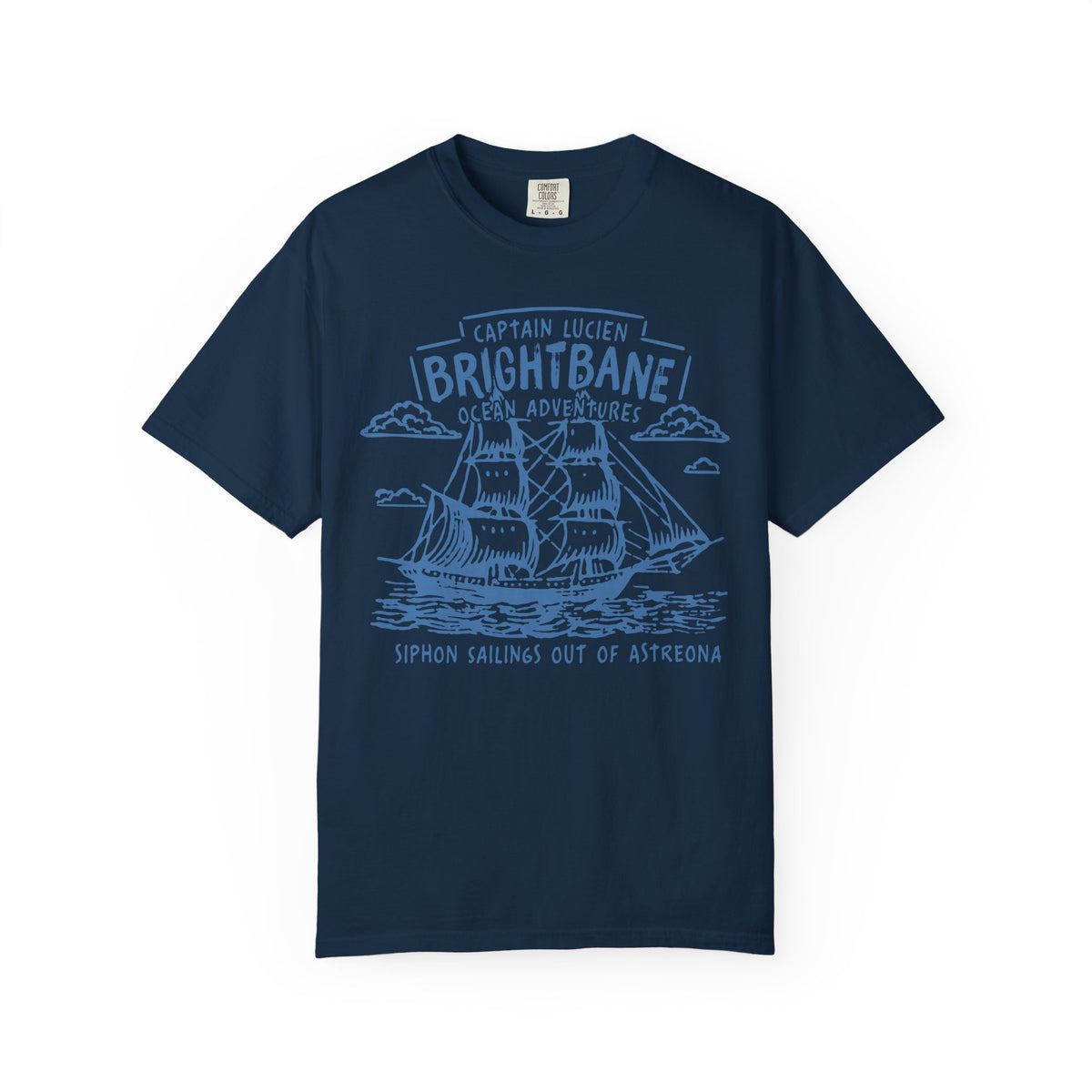 Navy comfort colors graphic tee from thtgrlreads featuring a vintage wash and a detailed light blue sailing ship print with "Captain Lucien Brightbane Ocean Adventure" text, part of Wolves of Ruin collection.