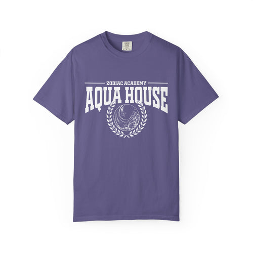 Zodiac Academy-themed Comfort Colors graphic tee by thtgrlreads featuring a vintage wash purple base with white "Aqua House" text and a wave emblem, perfect for Back to School fans.