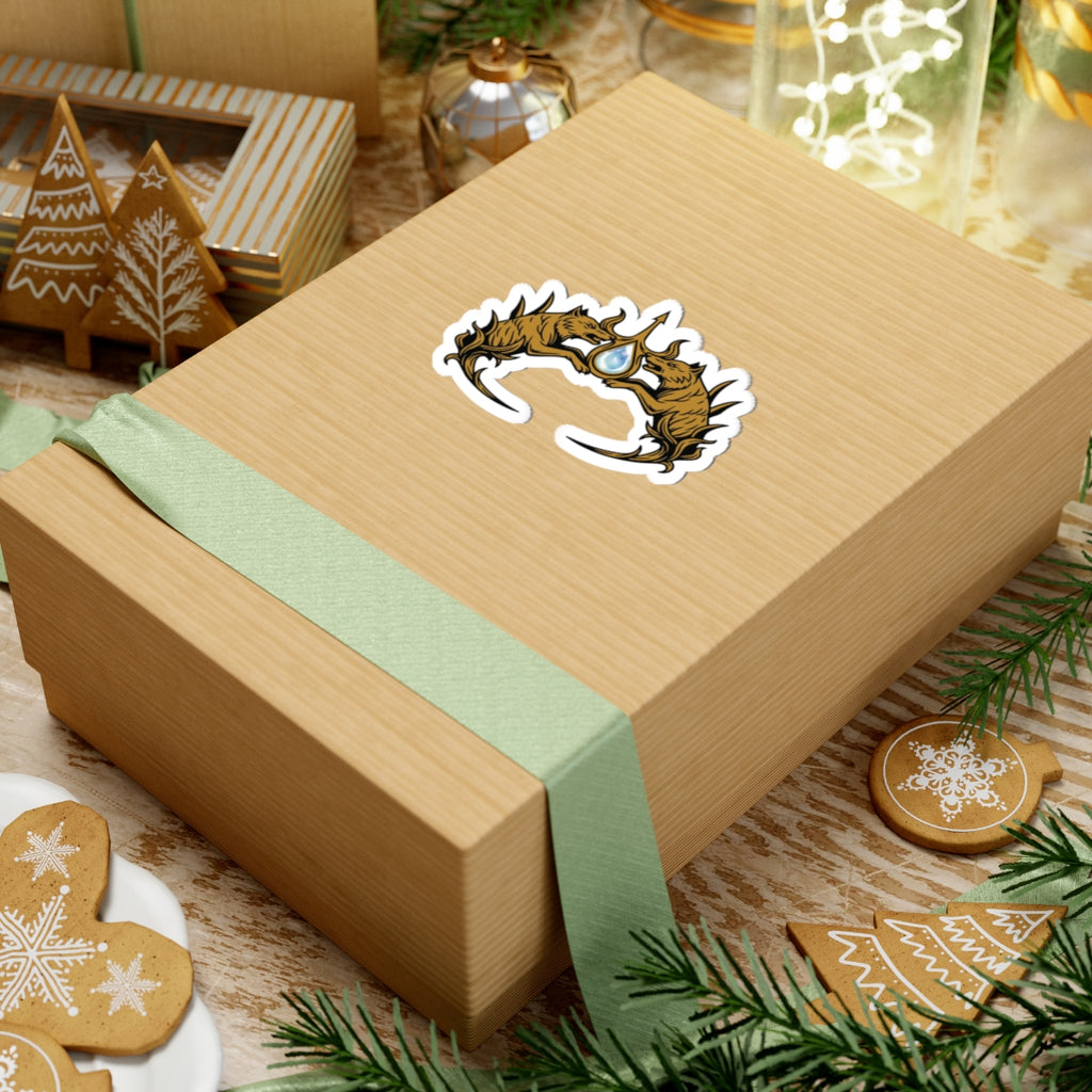 Sticker from the Wolves of Ruin collection by thtgrlreads featuring a detailed crown design inspired by Sable Sorensen’s fantasy series, displayed on a wrapped gift box.
