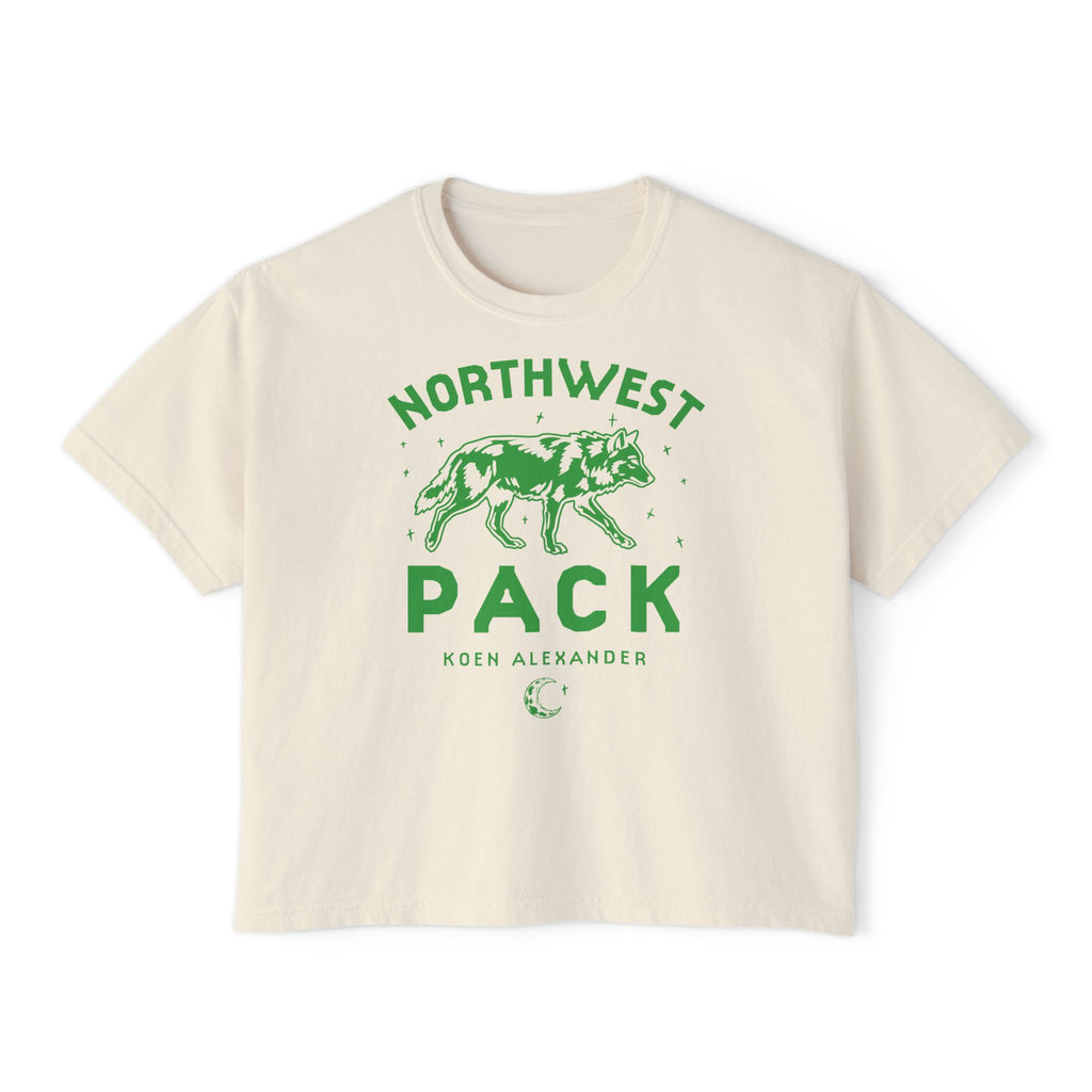 Cream cropped graphic tee with green Northwest Pack wolf artwork and Koen Alexander text, a vintage wash design from Thtgrlreads Ali Hazelwood collection