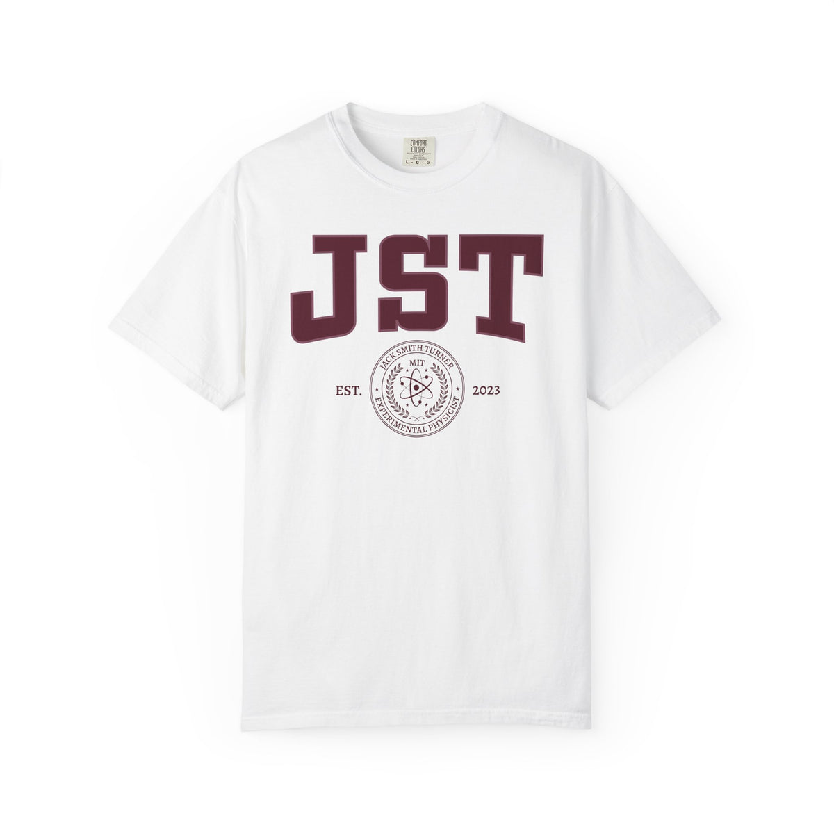 White Comfort Colors graphic tee featuring burgundy JST lettering, a circular academic seal, and 2023 details from Ali Hazelwood Tees by Printify