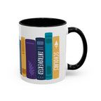 A white ceramic mug with black handle and interior featuring colorful book spine illustrations labeled "Introverted" and "Scholars," part of thtgrlreads bookish merch.