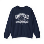 A navy oversized crewneck from thtgrlreads featuring Liv Zander collection text and a white vintage-style graphic reading “1st Annual Gravedigger Snowball Tournament” with a snowball splash design.
