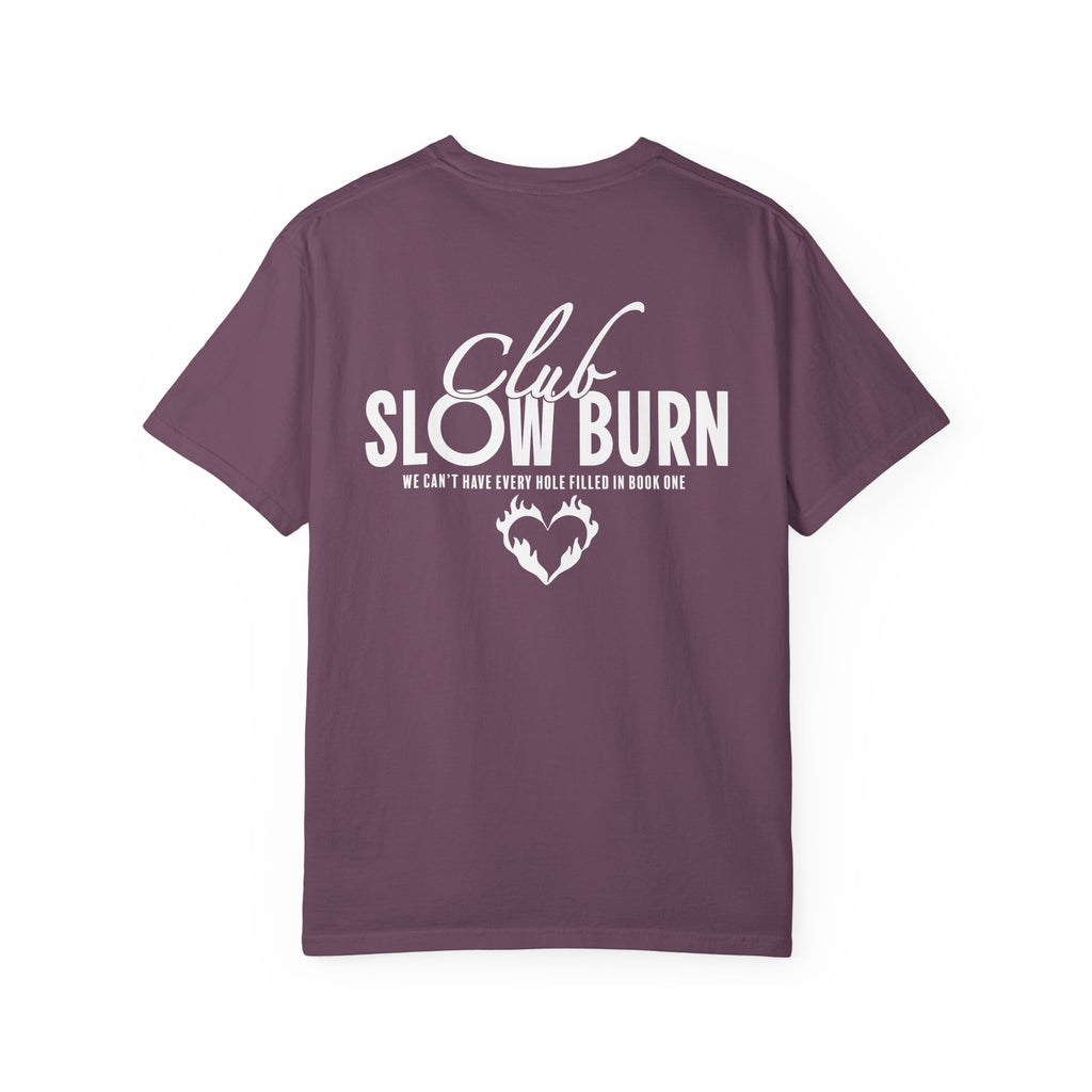 Officially licensed Club Slow Burn tee from thtgrlreads, featuring a premium Comfort Colors vintage-washed graphic tee with bold white text and a flaming heart design, part of the Book Bestie collection.