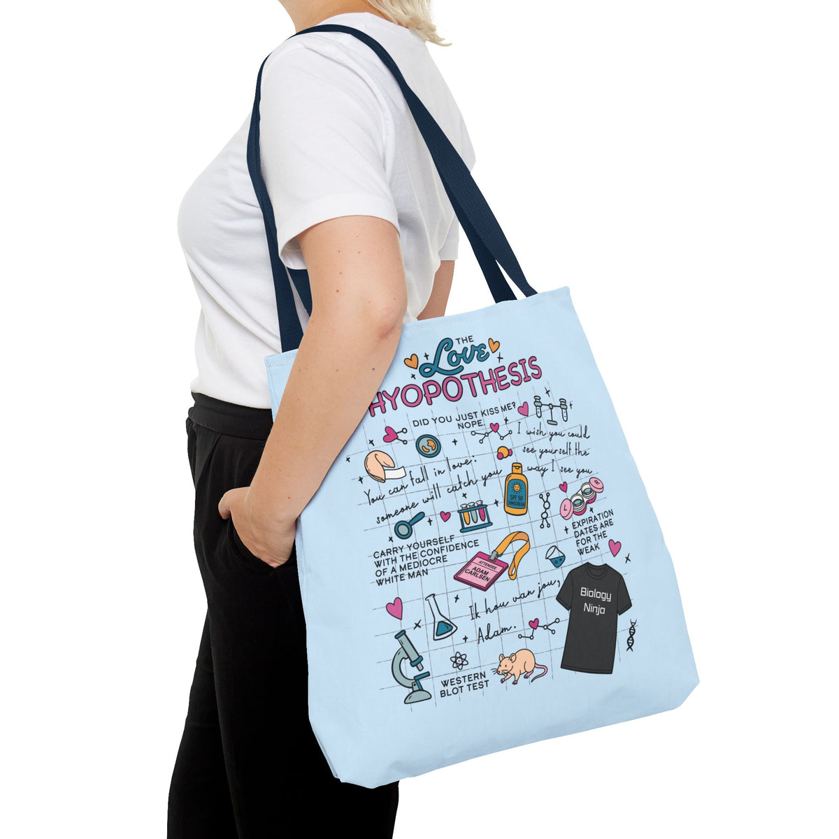Light blue The Love Hypothesis tote bag with illustrated science and romance graphics, worn over the shoulder, from the Ali Hazelwood collection by Printify
