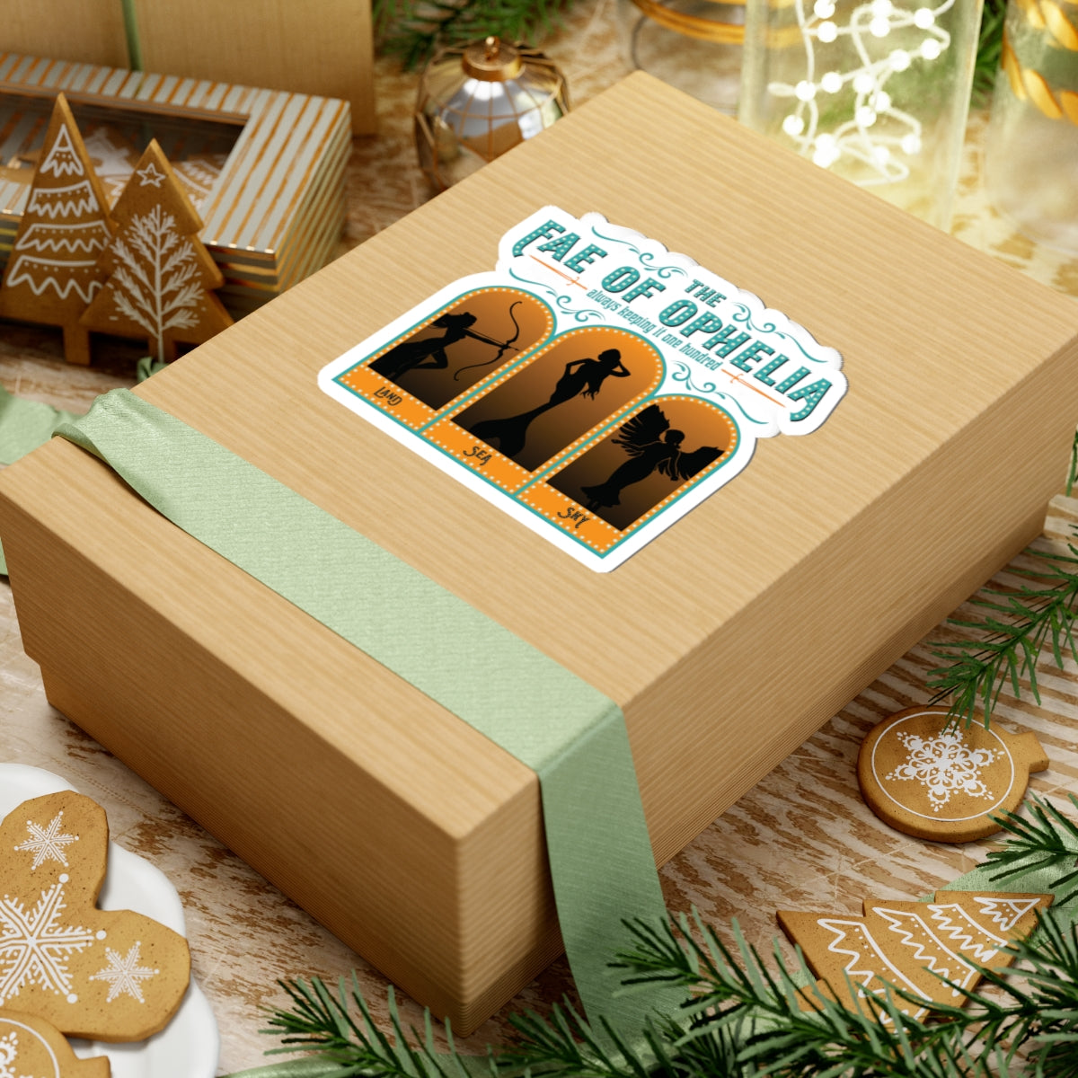 A holiday gift box wrapped with a sage green ribbon featuring a Fae of Ophelia sticker by thtgrlreads, part of the Stickers and The Life of a Book Bestie collections.