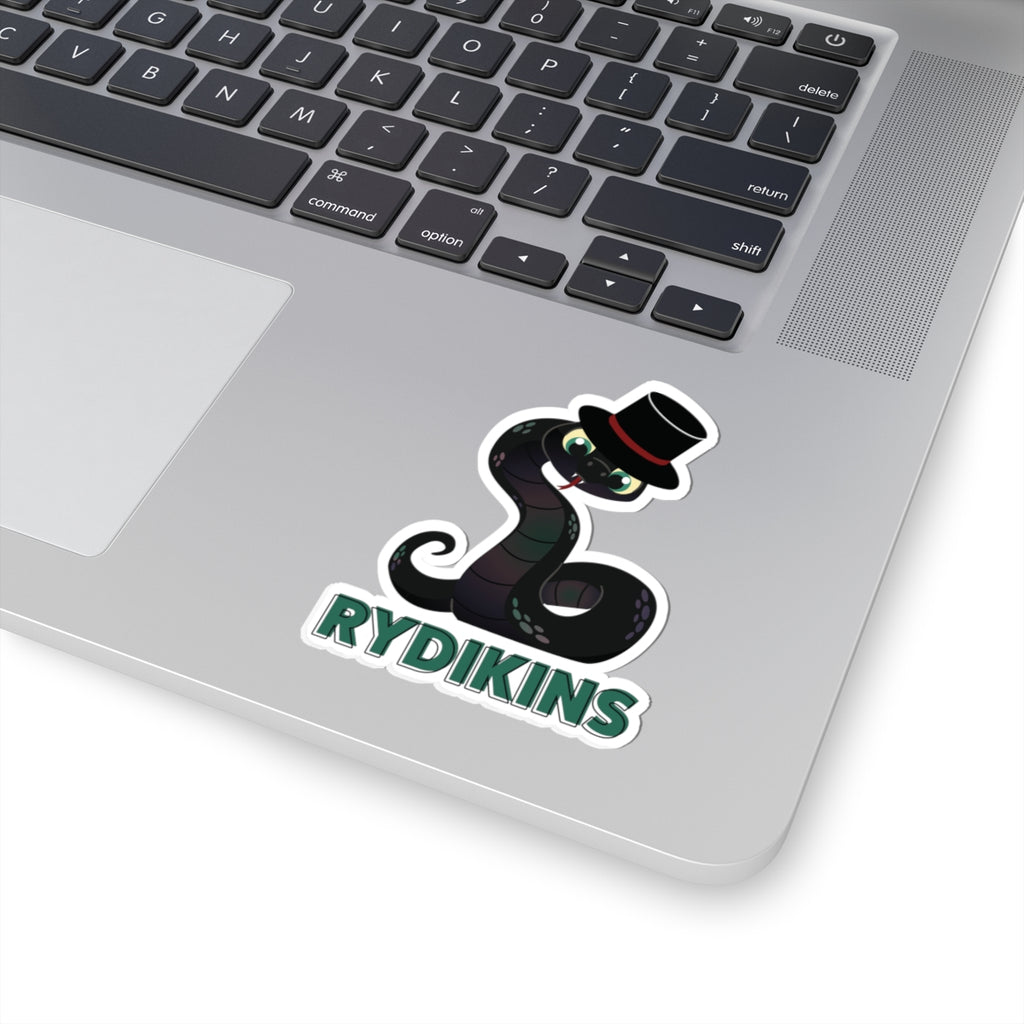 Rydikins sticker from thtgrlreads featuring a black snake wearing a top hat with green eyes and the text "RYDIKINS," part of the Ruthless Boys of the Zodiac and Stickers collections.