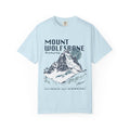 Thtgrlreads comfort colors graphic tee from the Wolves of Ruin collection featuring a vintage wash light blue fabric with a bold mountain print and stylized text referencing Mount Wolfsbane.