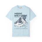 Thtgrlreads comfort colors graphic tee from the Wolves of Ruin collection featuring a vintage wash light blue fabric with a bold mountain print and stylized text referencing Mount Wolfsbane.