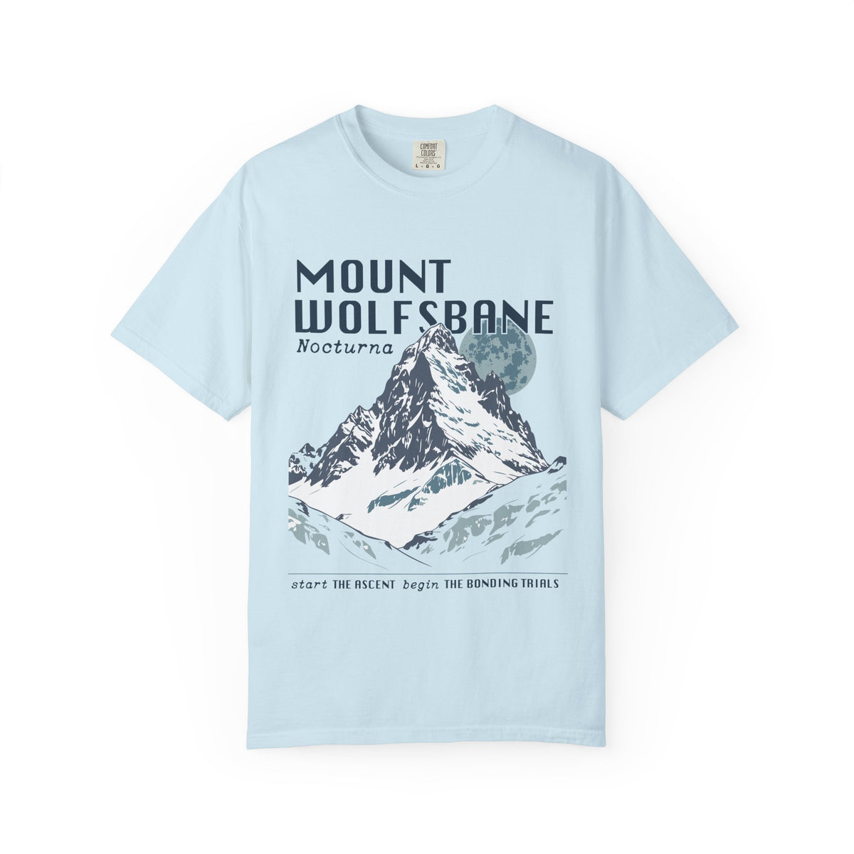 Thtgrlreads comfort colors graphic tee from the Wolves of Ruin collection featuring a vintage wash light blue fabric with a bold mountain print and stylized text referencing Mount Wolfsbane.