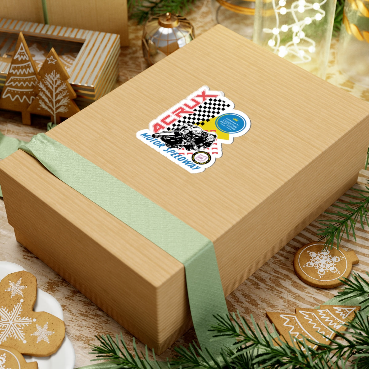 Acrux Motor Speedway sticker from thtgrlreads featuring a vintage racing design with checkered flags, part of the Zodiac Academy and Stickers collections, displayed on a gift box.
