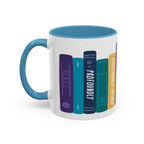 Thtgrlreads NC Book Bestie Mug featuring a colorful stack of stylized book spines with playful titles, designed on a white ceramic mug with a blue handle and interior.
