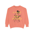 A coral oversized crewneck sweatshirt from thtgrlreads featuring a vintage-style illustration of a woman reading and yellow text "A Court of Feral Fangirls" on soft Comfort Colors fabric, perfect for fans in the Book Bestie and Off Brand collections.