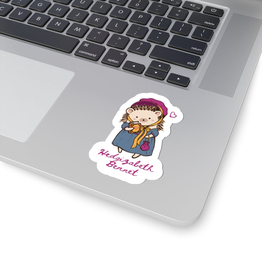 Hedgizabeth Bennet illustrated vinyl sticker featuring a hedgehog in period attire with a teacup, displayed on a laptop by Thtgrlreads for Ali Hazelwood fans.