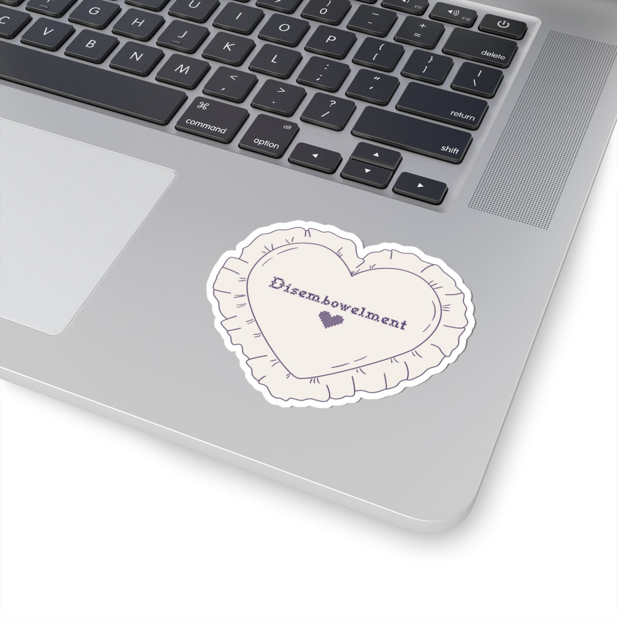 A heart-shaped embroidered sticker from the Poison Daughter collection by thtgrlreads, featuring the word "Disembowelment" in a delicate script with a small heart detail, perfect for bookish merch fans.