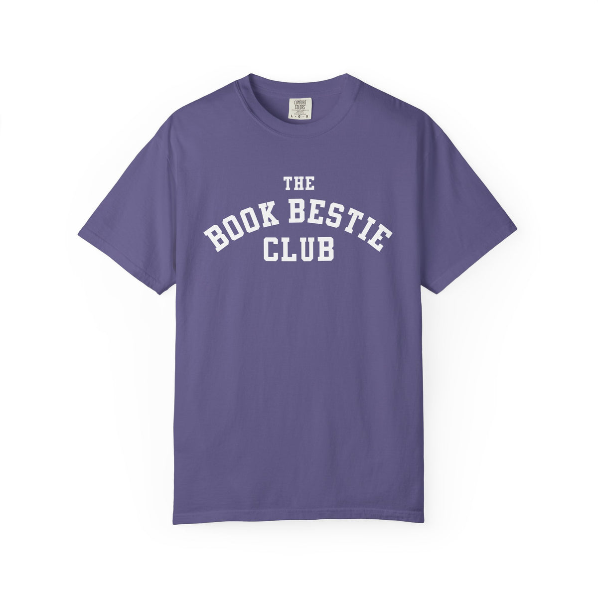 Comfort Colors graphic tee in vintage purple with white collegiate-style text reading "The Book Bestie Club," officially licensed by thtgrlreads from the Book Bestie collection.