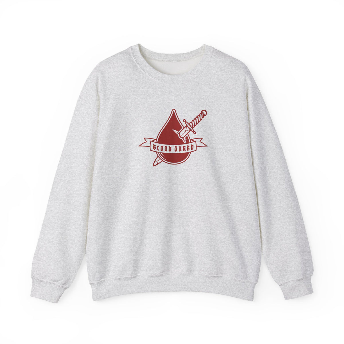 Thtgrlreads Bloodwing Academy crewneck featuring a vintage-washed Comfort Colors fabric with a bold red graphic of a dagger and blood drop with "Blood Guard" text, part of officially licensed bookish apparel collections.