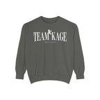 Bloodwing Academy crewneck sweatshirt from thtgrlreads featuring a vintage-wash, soft gray Comfort Colors fabric with bold white "TEAM KAGE" text and a small graphic print.