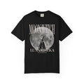 Thtgrlreads officially licensed Moon Witch Comfort Colors graphic tee from The Eating Woods collection featuring vintage-wash black fabric with a large moon and witch illustration in soft gothic fonts.