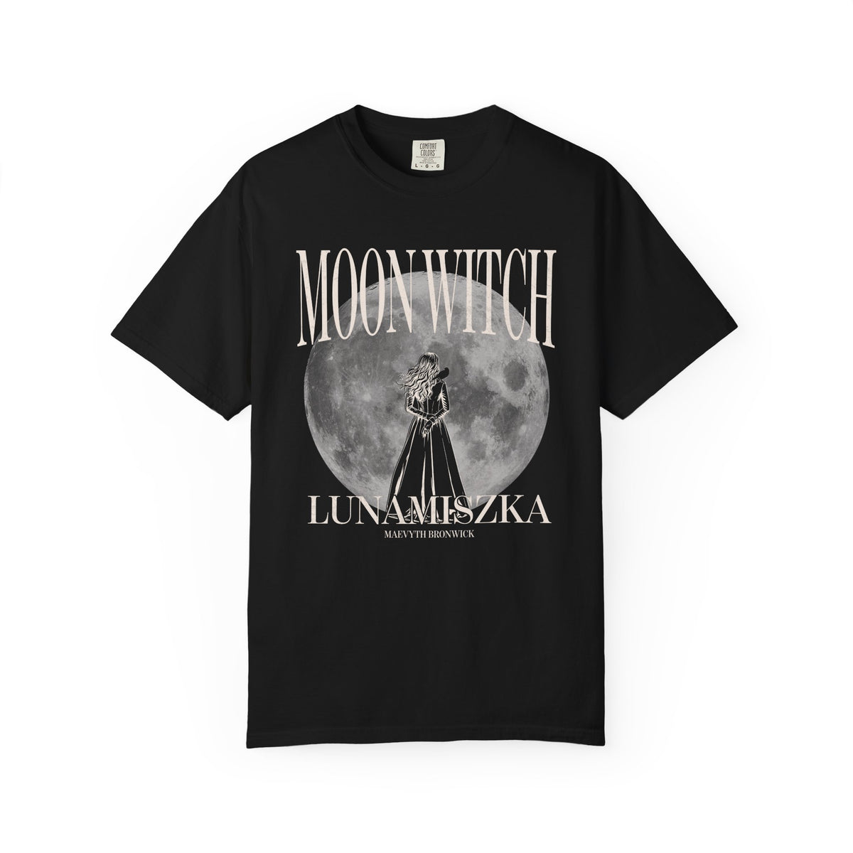 Thtgrlreads officially licensed Moon Witch Comfort Colors graphic tee from The Eating Woods collection featuring vintage-wash black fabric with a large moon and witch illustration in soft gothic fonts.