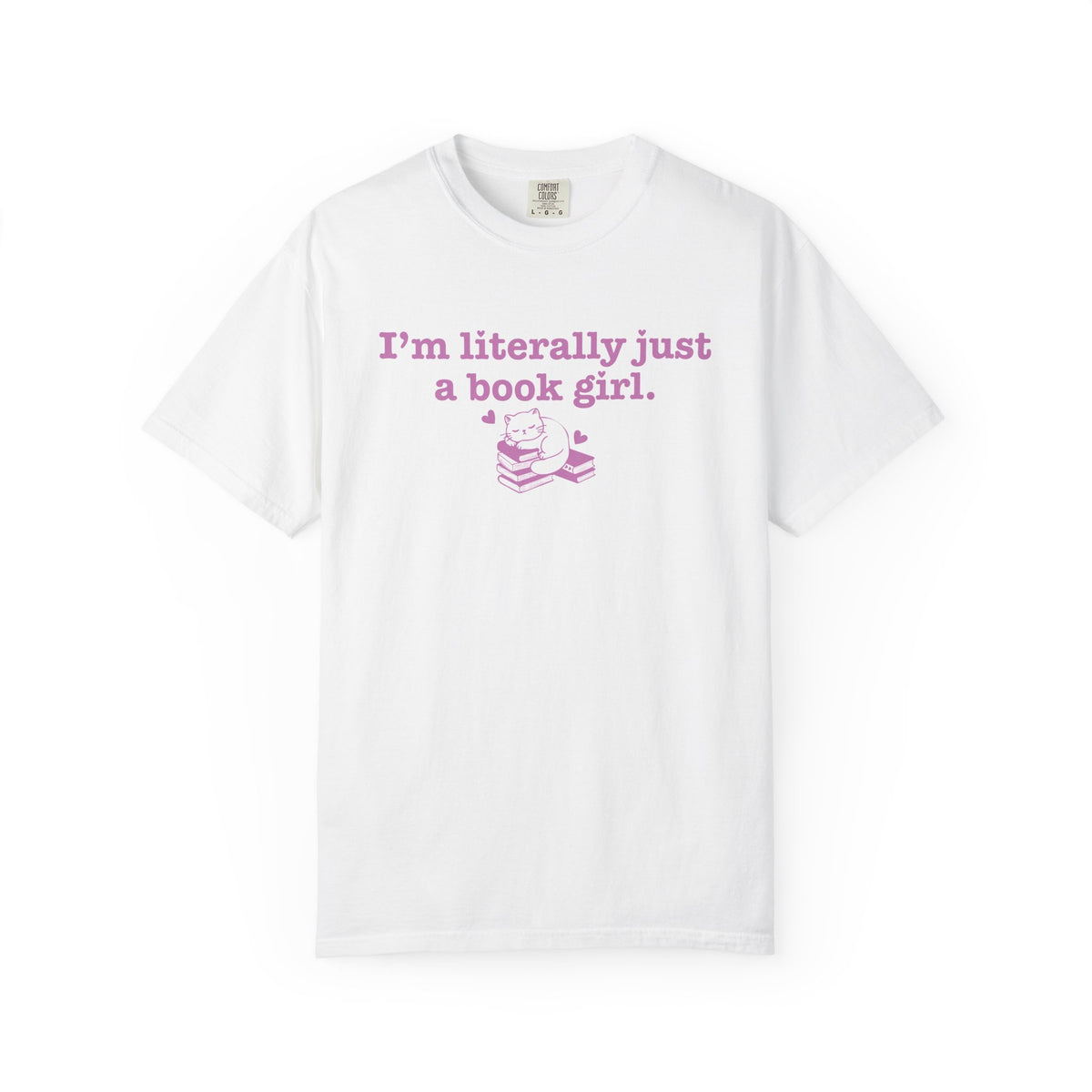 White Comfort Colors graphic tee from thtgrlreads featuring a pastel pink text and illustration design reading "I'm literally just a book girl" with a cat on stacked books, part of the Tees and Book Bestie collections.