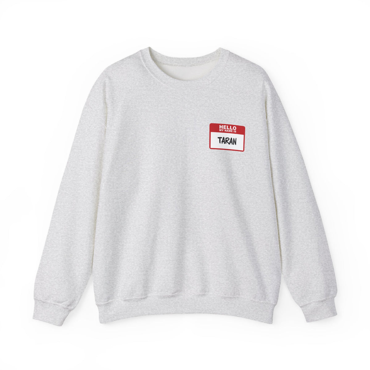A soft vintage-wash crewneck from thtgrlreads featuring a red and white "Hello My Name Is Taran" nametag graphic, part of the Kindred's Curse Saga collection.