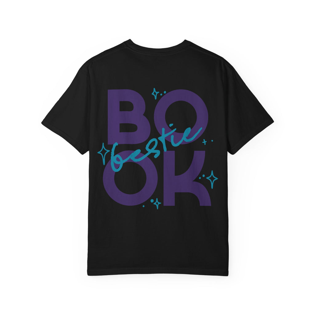 Thtgrlreads Book Bestie collection black Comfort Colors graphic tee featuring bold purple "BOOK" text with blue handwritten "bestie" overlay and star accents, unisex fit.