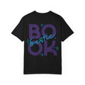 Thtgrlreads Book Bestie collection black Comfort Colors graphic tee featuring bold purple "BOOK" text with blue handwritten "bestie" overlay and star accents, unisex fit.