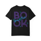 Thtgrlreads Book Bestie collection black Comfort Colors graphic tee featuring bold purple "BOOK" text with blue handwritten "bestie" overlay and star accents, unisex fit.