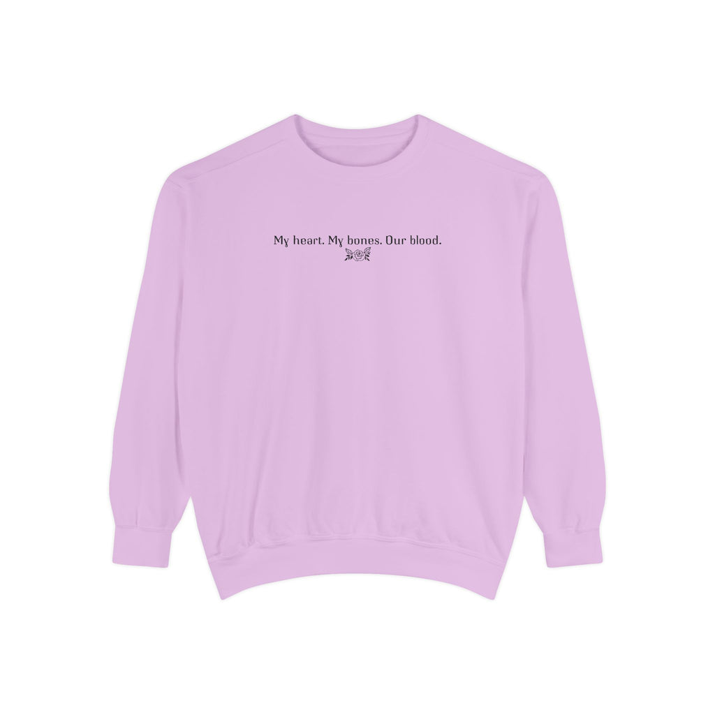 Officially licensed The Poison Daughter crewneck from thtgrlreads featuring a vintage-washed lavender Comfort Colors oversized sweatshirt with black gothic script text reading "My heart. My bones. Our blood.