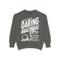 Darkmore Penitentiary-themed cozy oversized crewneck sweatshirt in muted gray with bold white vintage puff print graphic reading "Daring Anacondas" alongside handcuffs and ball-and-chain illustration, from thtgrlreads.