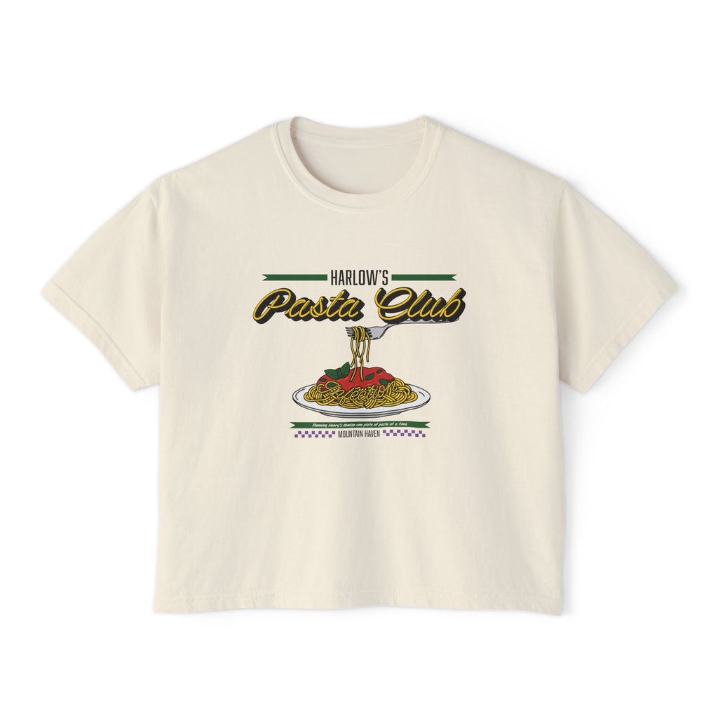 A cream-colored Comfort Colors cropped t-shirt from thtgrlreads featuring "Harlow's Pasta Club" vintage-style script and a colorful graphic of a fork twirling spaghetti over a plate, part of The Poison Daughter collection.