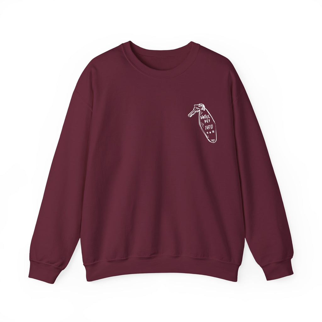 Thtgrlreads oversized crewneck sweatshirt from the Hockey Romance collection featuring a vintage wash Comfort Colors base in deep burgundy with a small minimalist graphic on the chest and relaxed unisex fit.