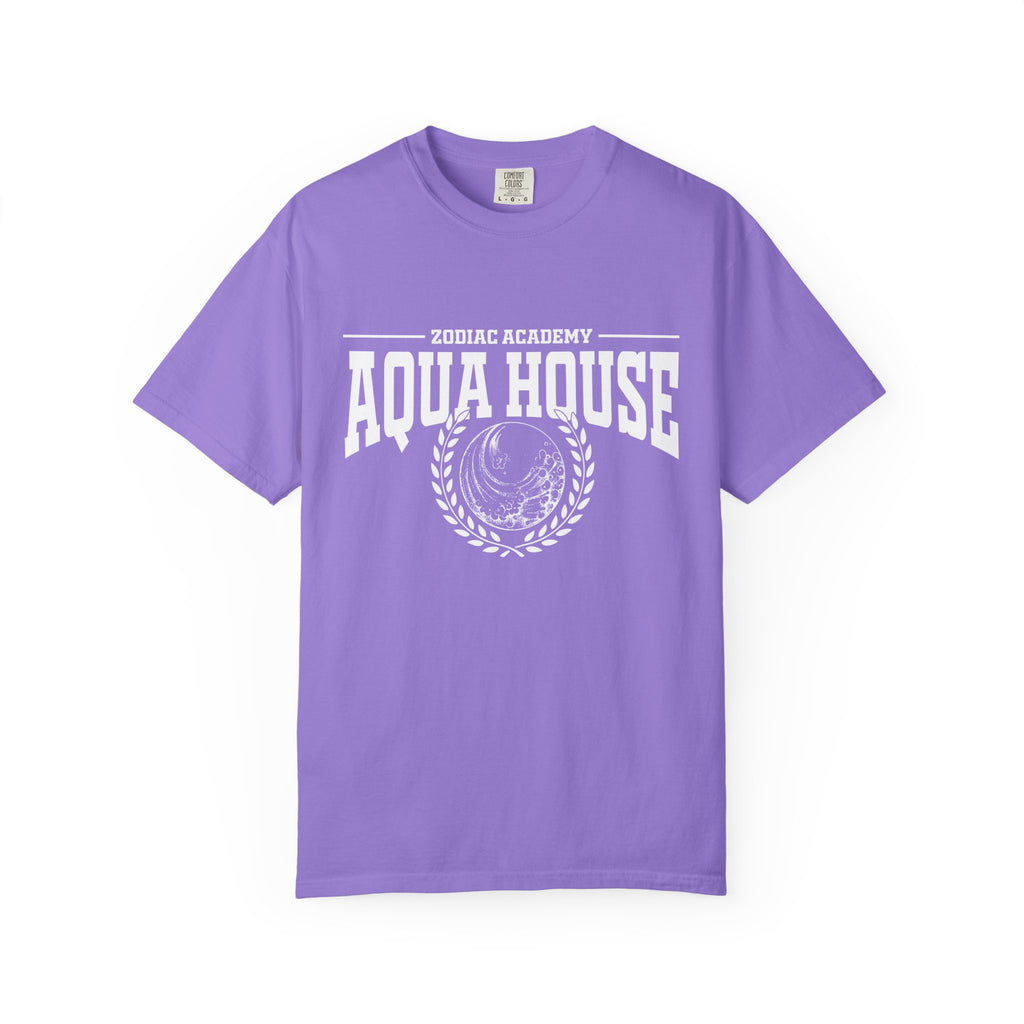 Zodiac Academy-themed comfort colors graphic tee by thtgrlreads in a vintage-washed lavender base featuring bold white "Aqua House" text and crest print, part of Back to School tees.